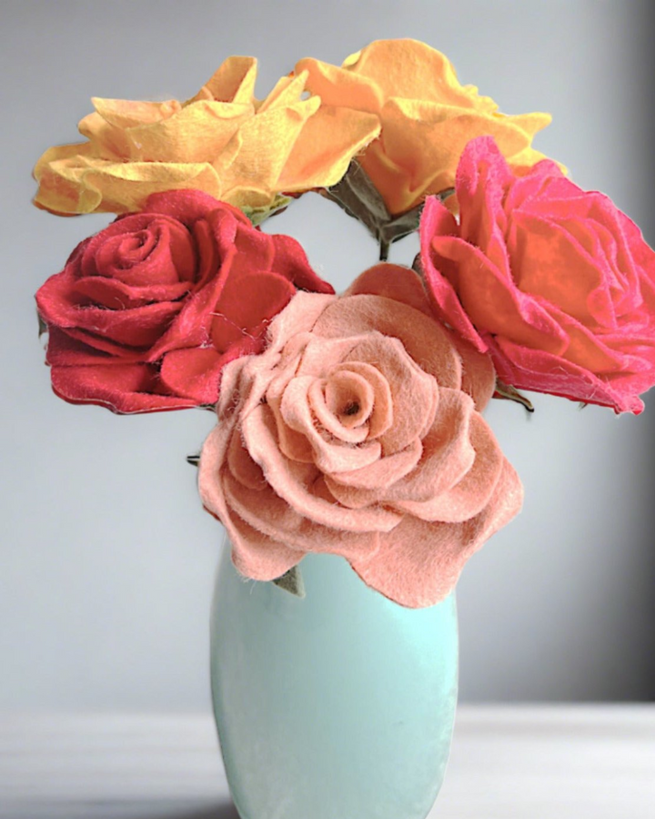 a vase filled with flowers sitting on top of a table
