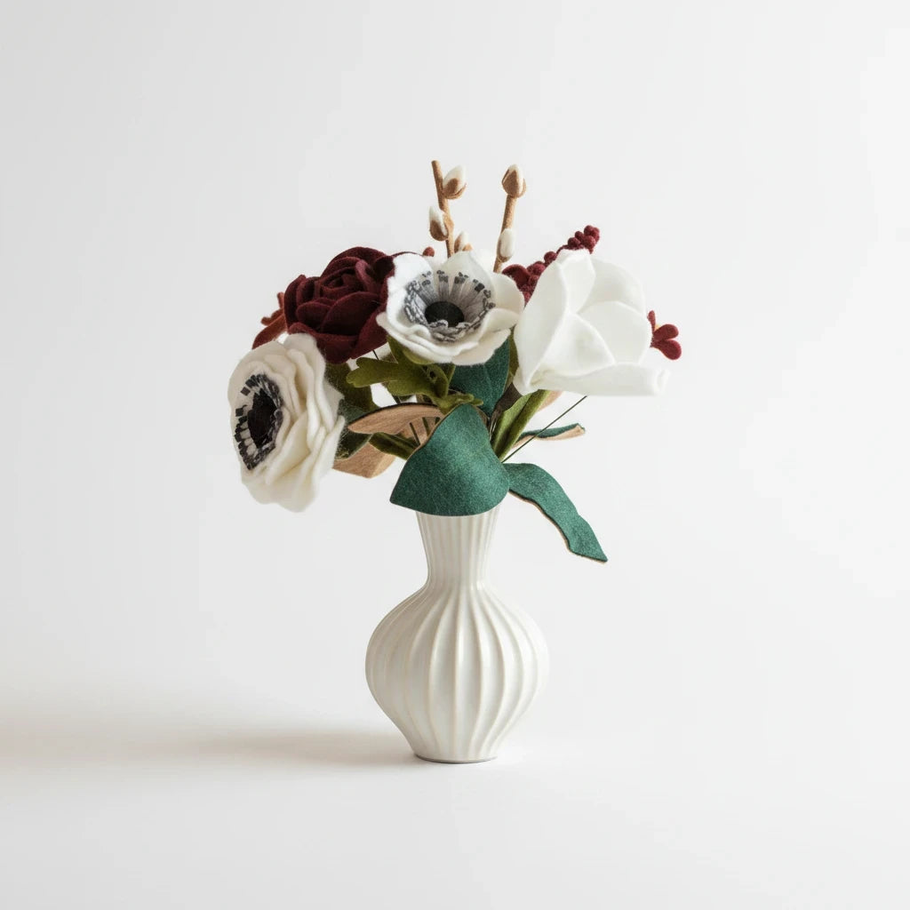 Melly Meier Botanicals handcrafted felt flower bouquet in deep burgundy and white with anemones and magnolias.